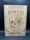 Wooden "Surviving purely out of spite" sign (8" x 10")